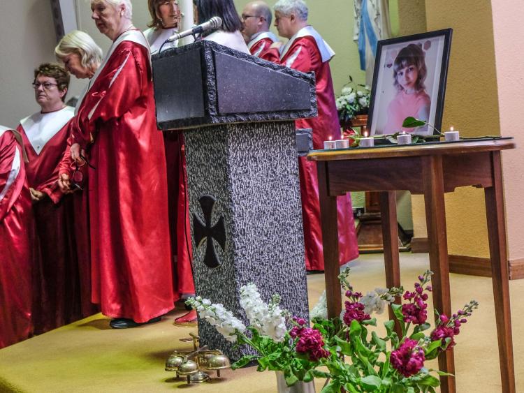 Rita Apine remembered at prayer service as 'a woman with a strong spirit' and 'full of love'