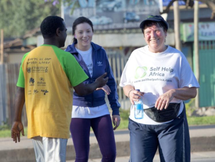 24/11/2013 repro free    Catherine Weir Tullamore, and Enda Teehan Tullow are congratulated by  Bellaw Damel Self Help Africa after completing  the Great Ethiopian run in Hawassa as opposed to the Capital Addis Ababa due to a security threat, part of a group of 20 from Ireland who ran the race in aid of Self Help Africa. Photo:Andrew Downes