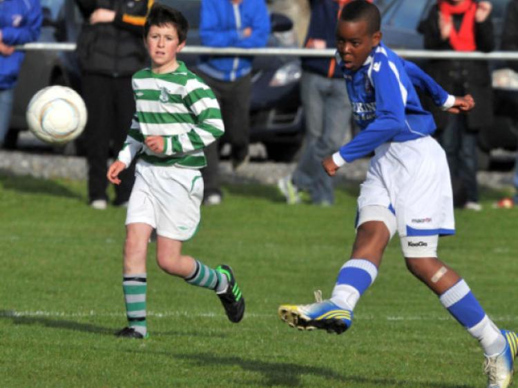 GOAL! Success Edogan scores Freebooters A's first goal in their Under-12 Cup final win over Evergreen A at Derdimus. Photo: Michael Brophy