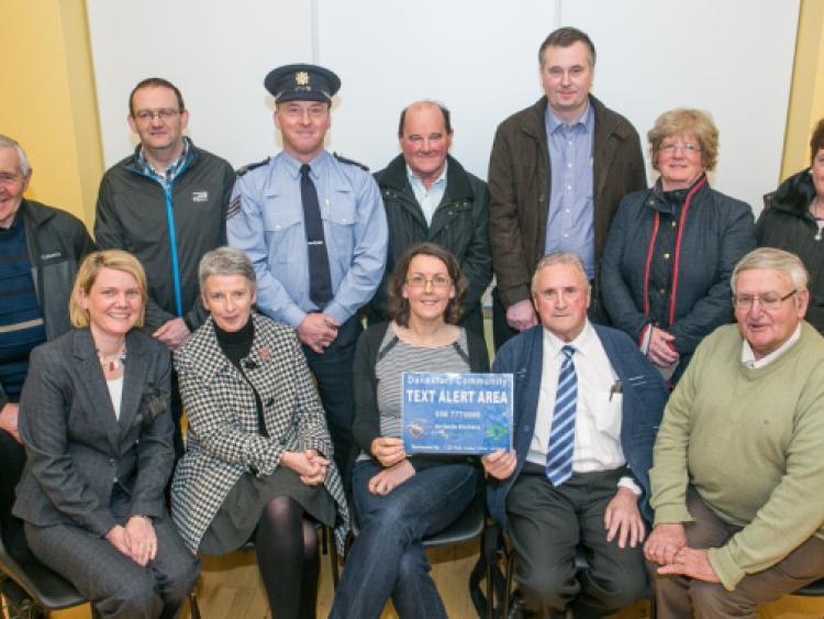 Nicola Murphy, Margaret Quinn, Fionnuala Davis, Cllr Billy Ireland, Tom O'Shea, John Sullivan, Philip Molloy, Sgt Ted Hughes, Donal Sheridan, Neville Stanley, Catherine David and Breda Farrell pictured at the launch of the Danesfort Community Text Alert. Photo: Pat Moore.