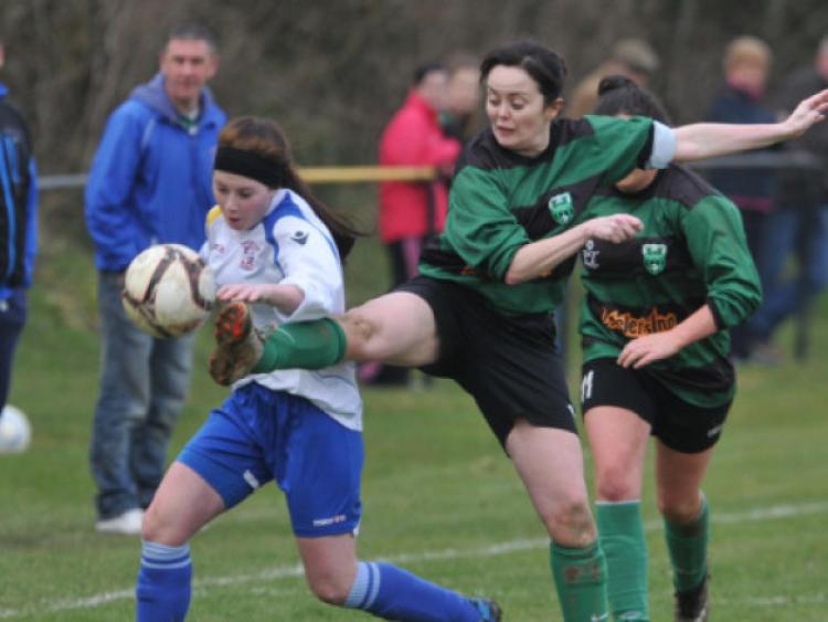 Lauren Valentine (Freebooters) in action against Edel Harding (Tullaroan) during the Women's Shield final. Photo: Michael Brophy