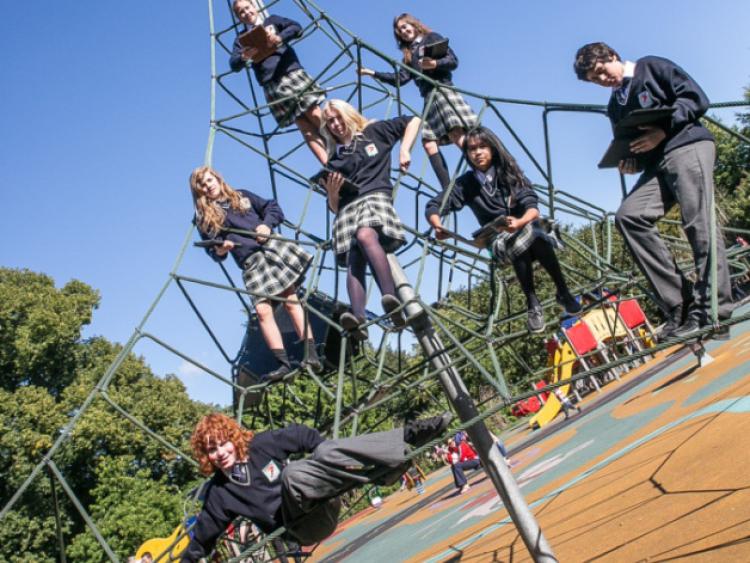 Tadhg O hAinle, Tessa Millie, Tamaryn Pienar, Roisin ni Dillun, Freagh Ni Cheallaigh, Doireann Ni Shluain and Aaron Gutierrez O'Mhurchu were measuring angles with ipads in the playground of Kilkenny Castle Park last week. Photo: Pat Moore.