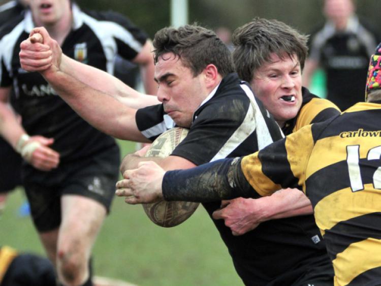 Kilkenny full-back Liam Caddy barges through the Carlow defence in the first round of the Provincial Towns Cup at Foulkstown. Photo: Michael Brophy