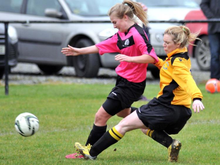 Jemma Komar (Kilkenny) slides in to challenge Clara Thornton (Combined Counties) during their Leinster inter-league semi-final on Sunday. Photo: Michael Brophy