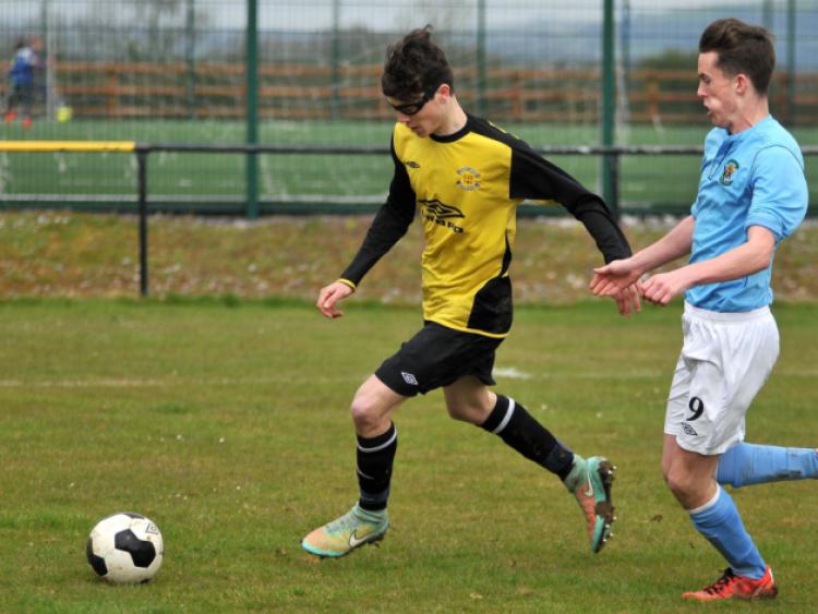 Sam Hickey (Kilkenny & District League) leads the race for the ball as Cian Flynn (North Dublin Schoolboys League) closes in. Photo: Michael Brophy
