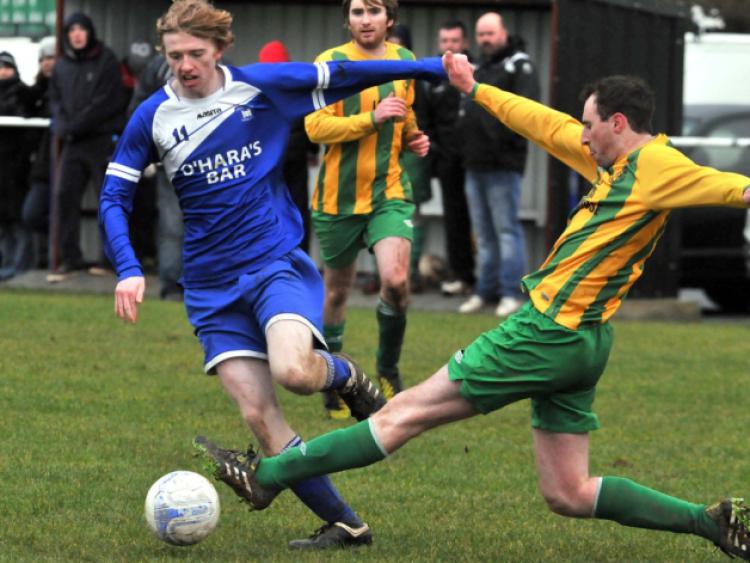 Nicky Cleere (East End United A) slides in to challenge Kelvyn Skehan (Thomastown United A) during their Premier Division clash in Thomastown. Photo: Michael Brophy