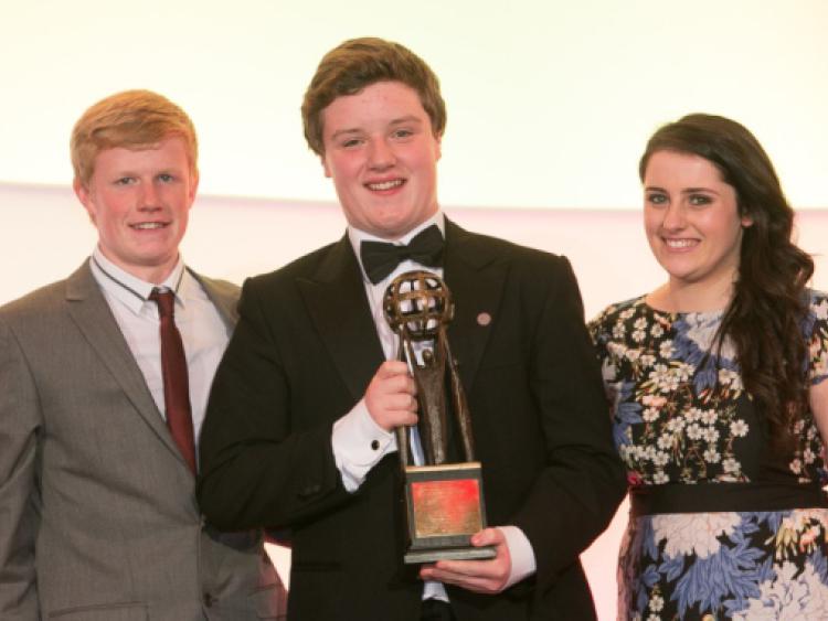 Danny Egars from Raheenduff in Co Kilkenny receives his No Name Club Host of the Year Award from last years Hostess and Host  Suzanne O'Donnell and Alan Hayes during the National Youth Awards at Lyrath Estate Hotel last Saturday night. Photo: Pat Moore.
