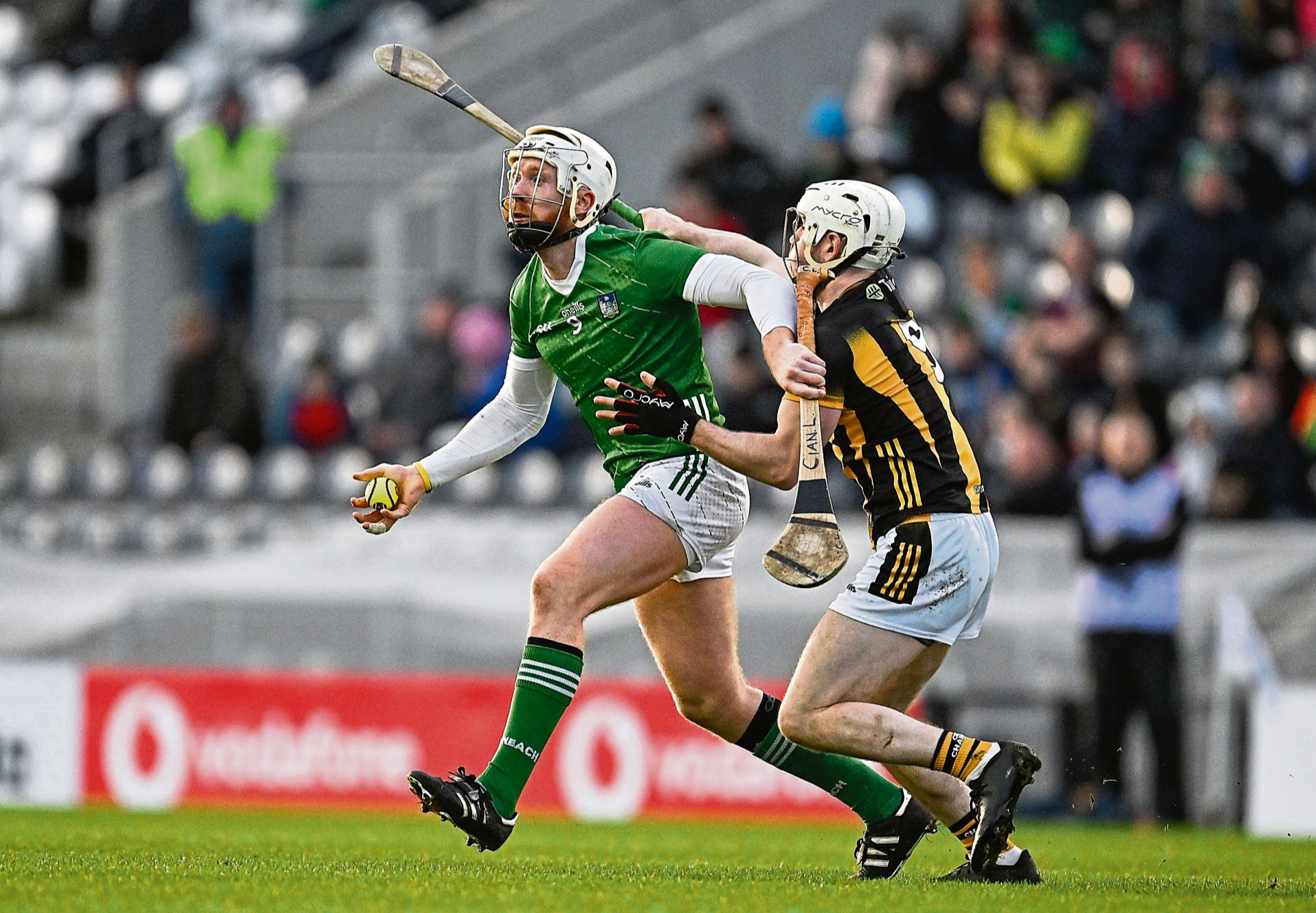 Cian Lynch, of Limerick, is tackled by Jordan Molloy of Kilkenny during the 2024 Allianz Hurling League Division 1 semi-final at SuperValu Páirc Ui Chaoimh in Cork