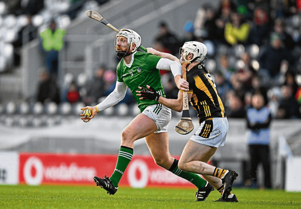 Cian Lynch, of Limerick, is tackled by Jordan Molloy of Kilkenny during the 2024 Allianz Hurling League Division 1 semi-final at SuperValu Páirc Ui Chaoimh in Cork