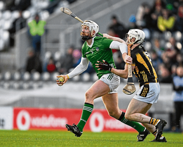 Cian Lynch, of Limerick, is tackled by Jordan Molloy of Kilkenny during the 2024 Allianz Hurling League Division 1 semi-final at SuperValu Páirc Ui Chaoimh in Cork