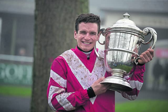 Danny Mullins holds the Goffs Thyestes Handicap Chase trophy after Total Recall’s win at Gowran Park in 2020. Picture: Patrick McCann/Racing Post