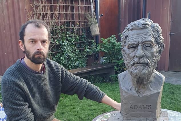 Aidan Harte pictured with a previoius project - the bust he sculpted of Gerry Adams