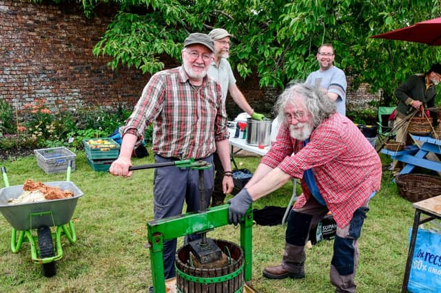 Hard at work crushing apples: Senator Malcolm Noonan and Xavier Barthelot. All pitures: Harry Reid.
