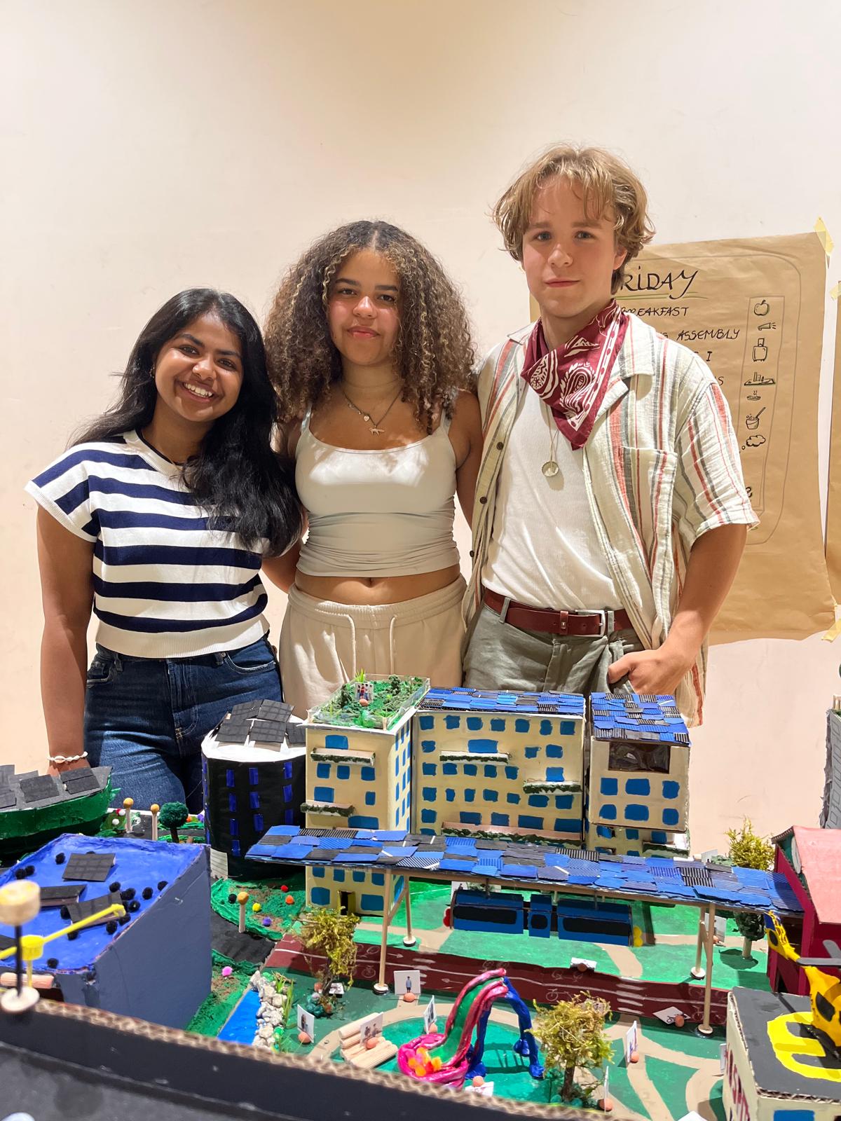 Rose, Susan and Rory at the camp in Germany with their miniature sustainable city blocks