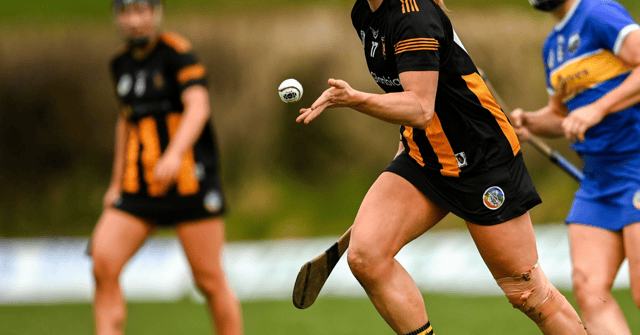 A Kilkenny player wearing a skort handpasses the sliothar. Picture: Sportsfile
