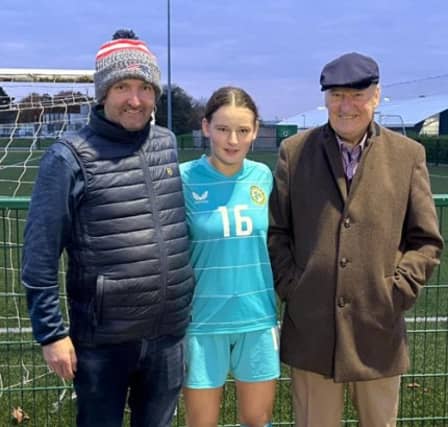 Isabelle Carroll pictured in the Ireland jersey with Paul and Pat Carroll PICTURE: Pat Robert Carroll