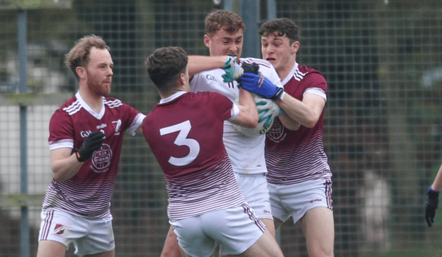 Dicksboro’s Liam Moore is surrounded by a number of Caragh defenders during Saturday’s IFC clash in Fresford. Picture: Daniel O’Neill