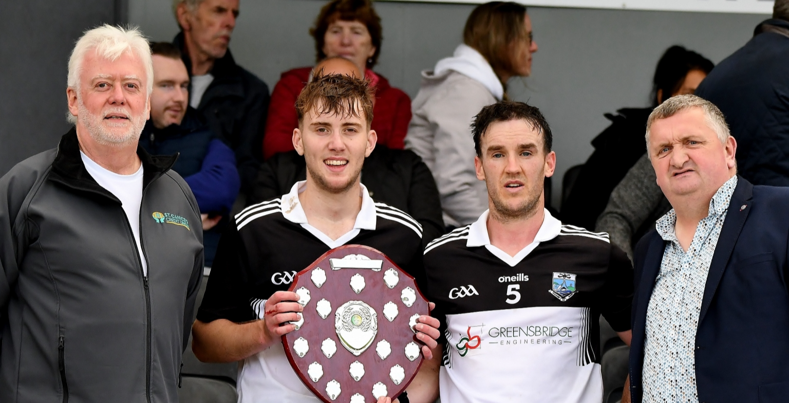 Mullinavat’s Ian Duggan and George O’Connor receive the Senior Shield from PJ Kenny and Vincent Kenrick, St Canice’s Credit Union.  Picture: Willie Dempsey