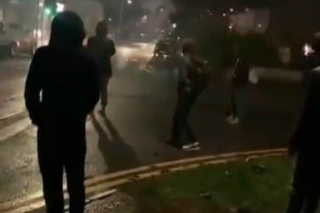 Videos circulating on social media show a group of approximately fifty youths, dressed in black and some wearing balaclavas, setting off fireworks in the built up neighbourhood terrorising residents and sending parents who were out with their children running for safety. 