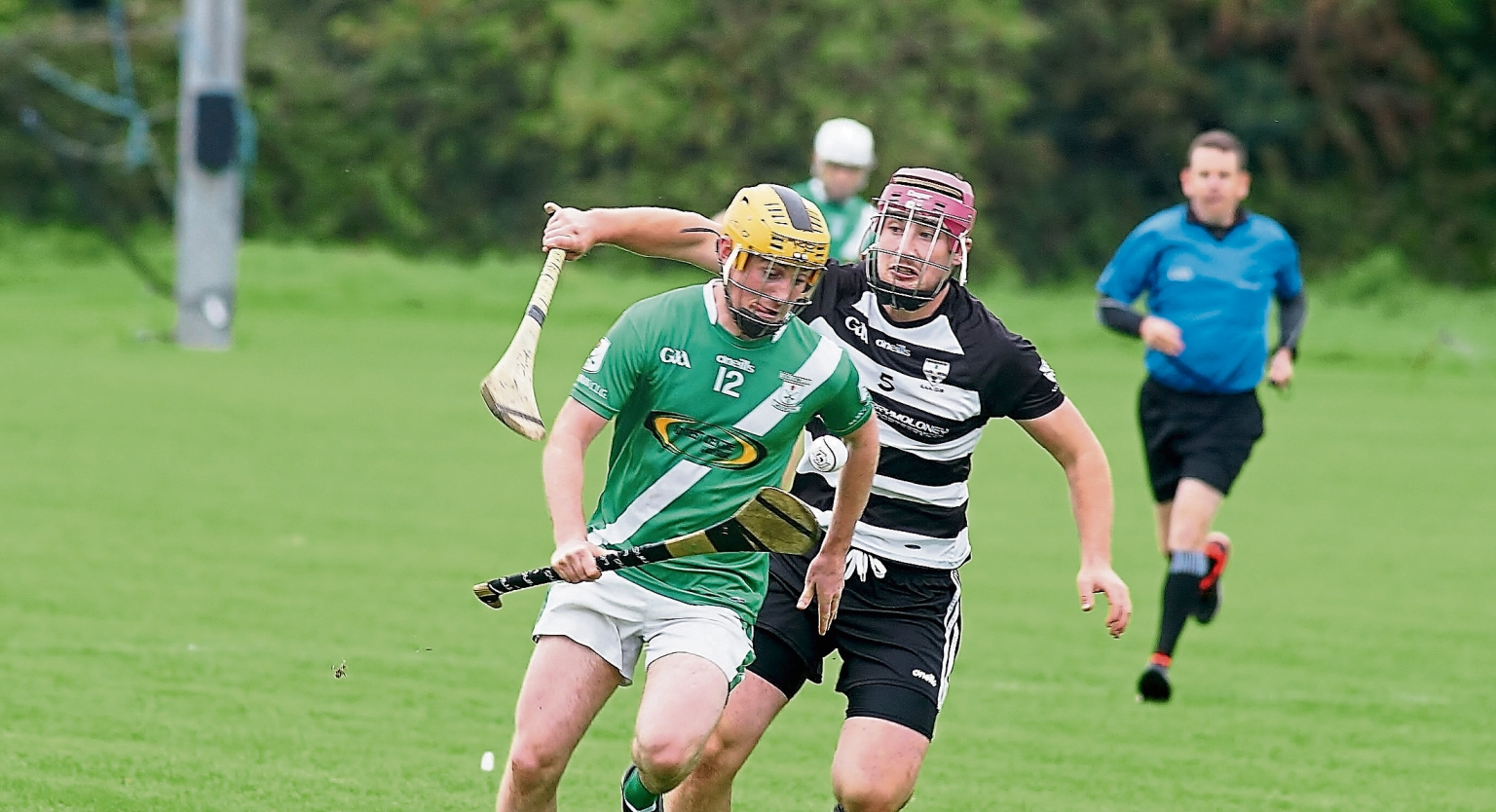 Mooncoin’s Killian Hogan gets away from Ian Foley of Blacks and Whites. Picture: Willie Dempsey