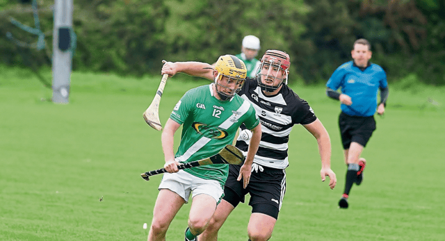 Mooncoin’s Killian Hogan gets away from Ian Foley of Blacks and Whites. Picture: Willie Dempsey