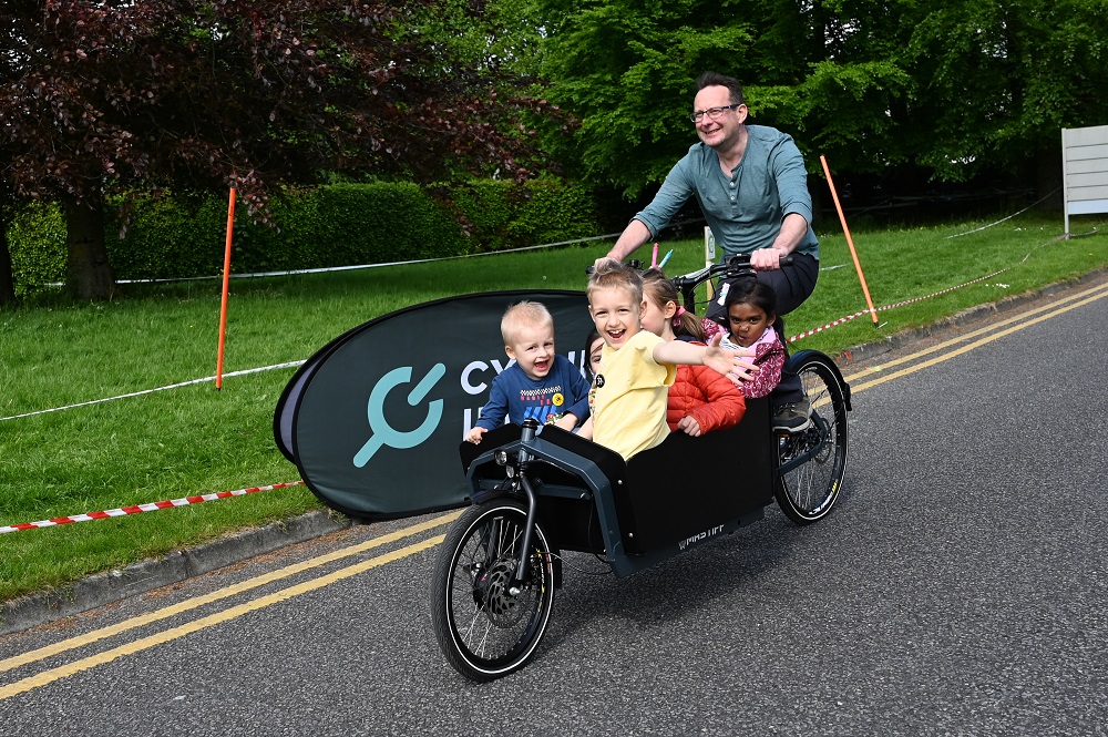 Fergus Horgan and his daughter and friends trying out the Cargo bike at Bike Fest in County Hall