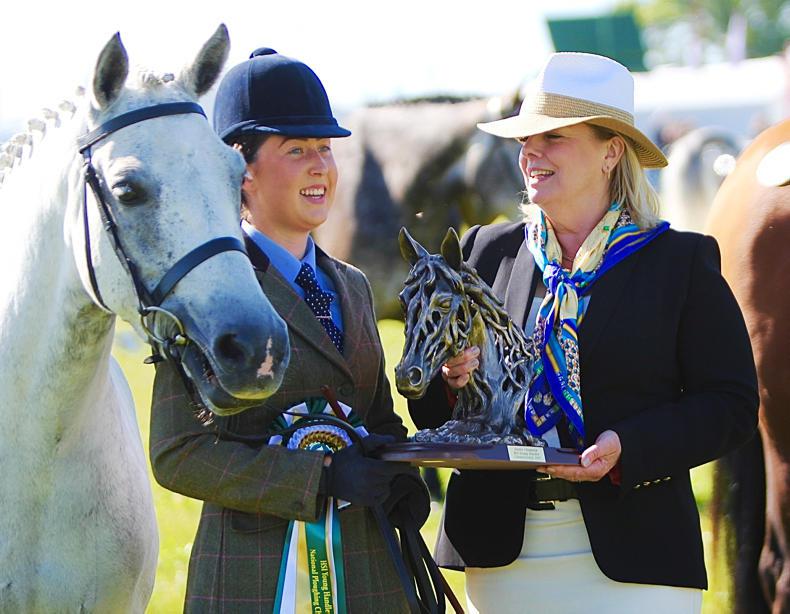 Roisin McGrath presented with her prize by Jane Darragh for the Horse Sport Ireland Young Handler Championship at the National Ploughing Championships 2019