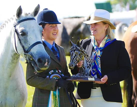 Roisin McGrath presented with her prize by Jane Darragh for the Horse Sport Ireland Young Handler Championship at the National Ploughing Championships 2019