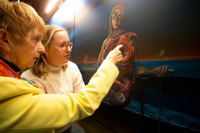 Vicky Phelan’s mother Gaby Kelly and Vicky’s daughter Amelia looking at the campaigner’s portrait by artist Vincent Devin