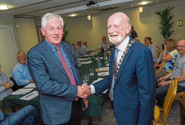 2017: The late Brian O'Callaghan (right) is presented with the Kilkenny Lions Club chain by former president Padraig Keegan at the Newpark Hotel. PICTURE: PAT MOORE