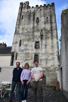 The Dowley family standing outside Tybroughney Castle