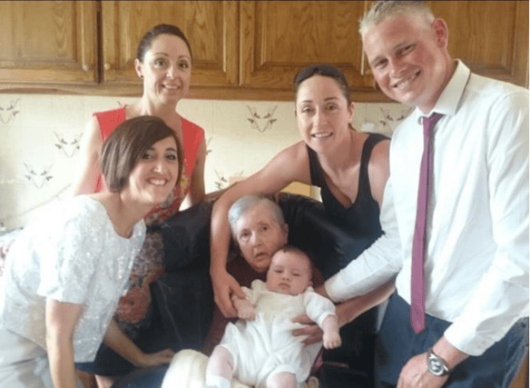 Marie and Julie Anne Bowden (at back) with their mother Kitty, brother Pat, sister in law Jenn and baby, Harvey,