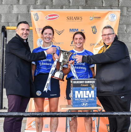 Thomastown joint captains Joanne Fitzpatrick and Sarah Walsh receive the Bridget 'Biddy' Barry memorial cup from Neil Lyng of Michael Lyng Motors and Kilkenny PRO Martin Quilty. Pic: Billy Culleton