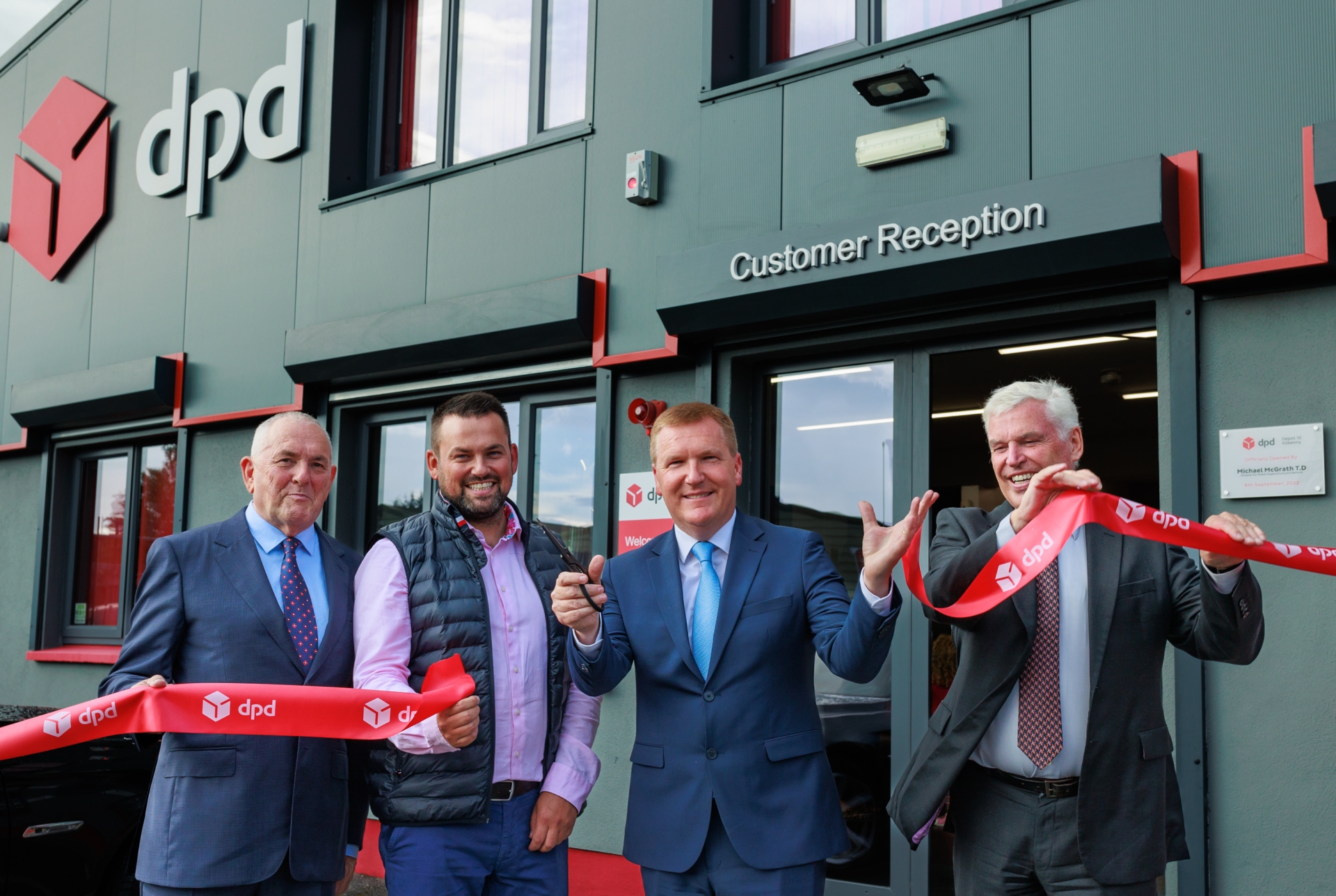 John McGuinness T.D.,Michael McGrath T.D. (Minister for Public Expenditure and Reform), M.J. McGuinness and Des Travers (CEO of DPD Ireland ) celebrate the official opening of DPD Ireland’s Kilkenny