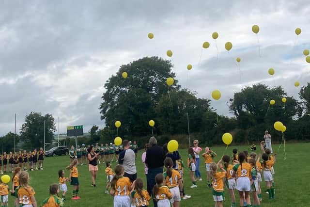 Yellow balloons floated towards the heavens as a Kilkenny community paid a sporting tribute to a special friend.