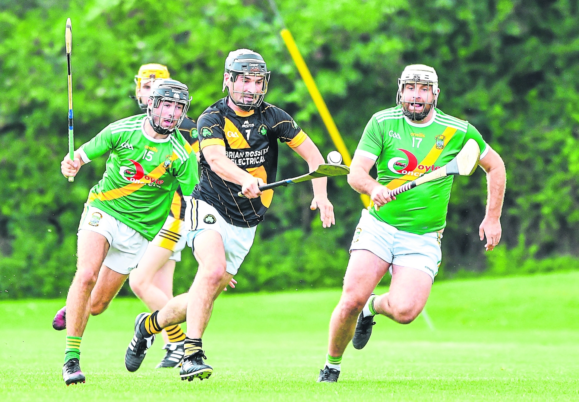 Kieran Mooney (Conahy Shamrocks) goes on a solo as Darragh Brennan and Luke Gaule (Carrickshock) give chase during their IHL clash at Tom Ryall Park.  Picture: Billy Culleton