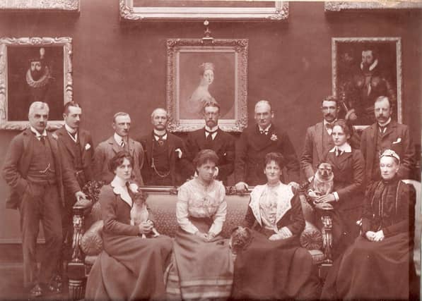 The Marchioness of Ormonde with her dog Sandy (centre) and her two daughters also with their dogs, Jim and Turk.