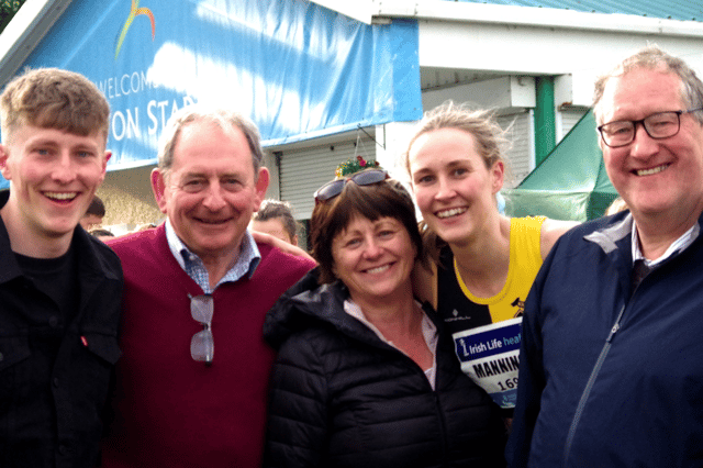 Cliodhna Manning (Kilkenny City Harriers) alongside her family after finishing third in the 400 metres at the Irish National Championship in Santry on Sunday