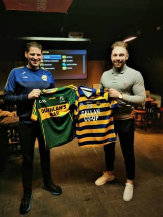 Paul Morrissey John Lockes and Eamon Brosnan Meelin GAA Cork swapping jerseys on the occasion of the Meelin clubs visit to John Locke Park