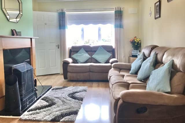 The ground floor comprises a fully fitted two-tone quality kitchen with wall and floor units, electric oven and hob and plumbing for washing machine and dishwasher. French doors with clear glass inserts leading into a warm and welcoming living room with an open fire place.