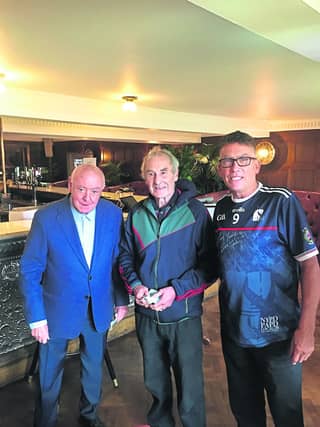 Michael Burke Langton’s Hotel on John Street with proprietor Eamon Langton on the left and Kilkenny hurling legend, Liam ‘Chunky’ O’Brien (centre)