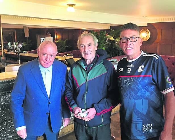 Michael Burke Langton’s Hotel on John Street with proprietor Eamon Langton on the left and Kilkenny hurling legend, Liam ‘Chunky’ O’Brien (centre)  
