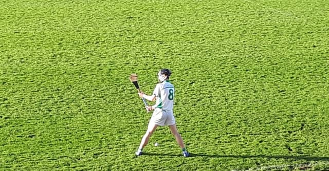 Conor Kelly stands over a free for O'Loughlin's