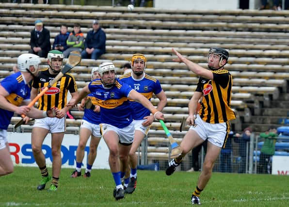 Conor Delaney (right) defends the Kilkenny line