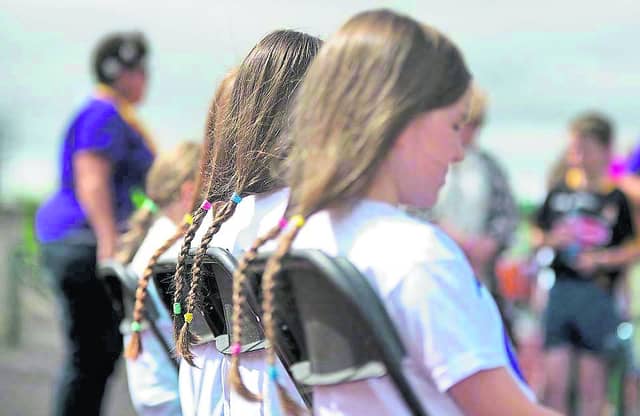 Teenagers at Relay for Life Kilkenny last year waiting to have their ponytails cut