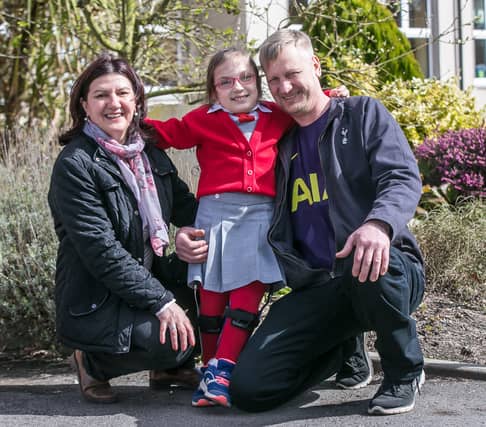 Cezy Fosca (12) with her parents Elena and Costel