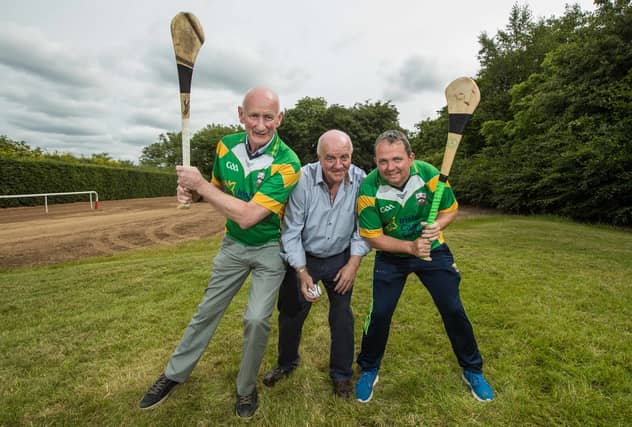 Cyril Farrell gets the game going with a throw in between opposing managers Brian Cody and Davy Fitzgerald