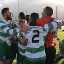 The Evergreen C players celebrate winning the Division Two league title on Sunday. Photo: Michael Brophy