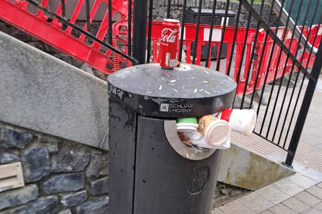 An overflowing public bin along the river in Kilkenny