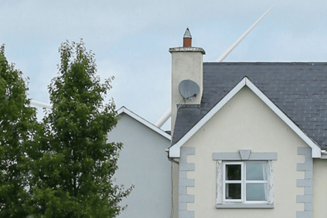 One of the proposed turbines seen from a residential area (rendered image submitted with original application)
